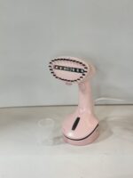 ⁦مكواة بخار يدوية محمولة من ماركة "Universal".⁩ - الصورة ⁦4⁩